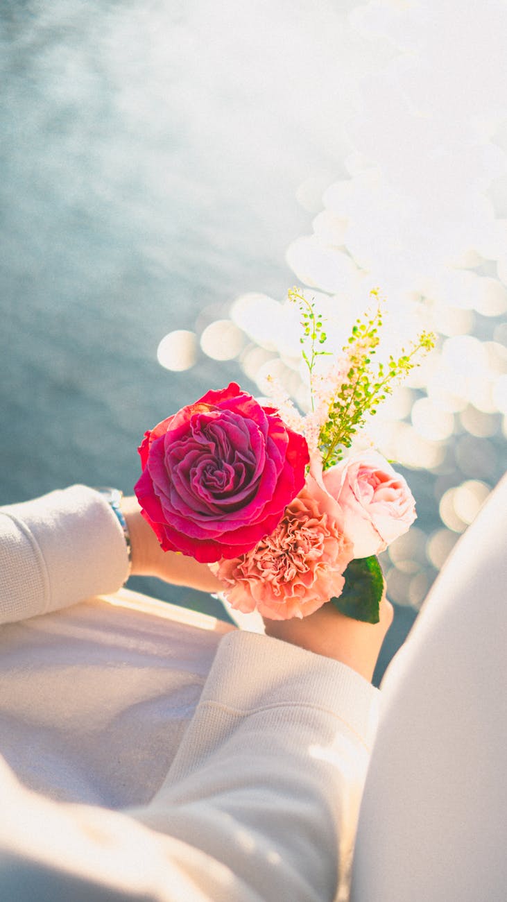 vibrant floral bouquet held by woman outdoors